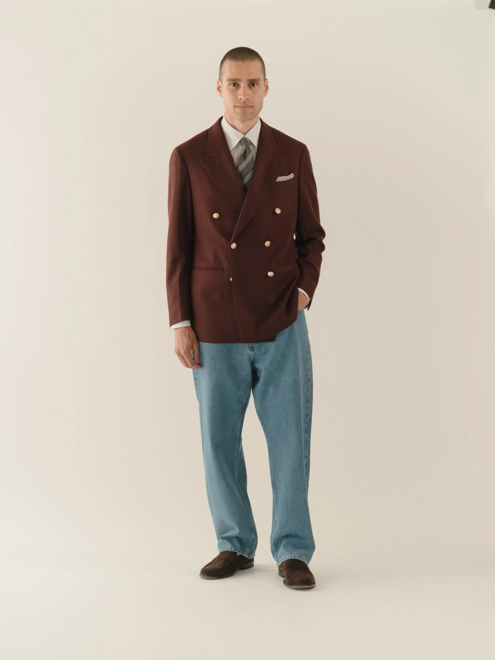 Burgundy double-breasted blazer over light jeans
