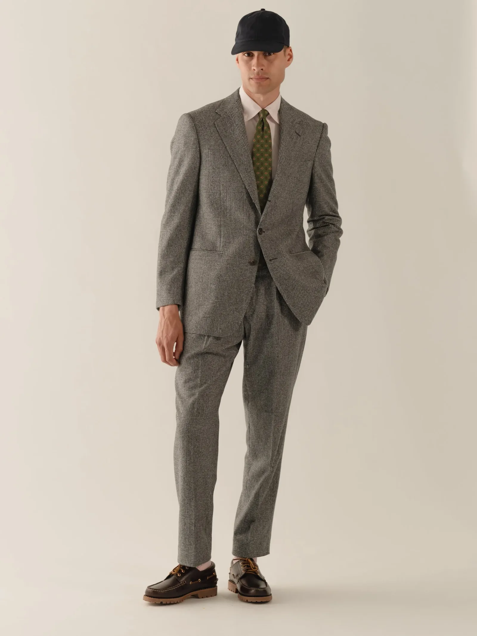 Grey check suit with a cap
