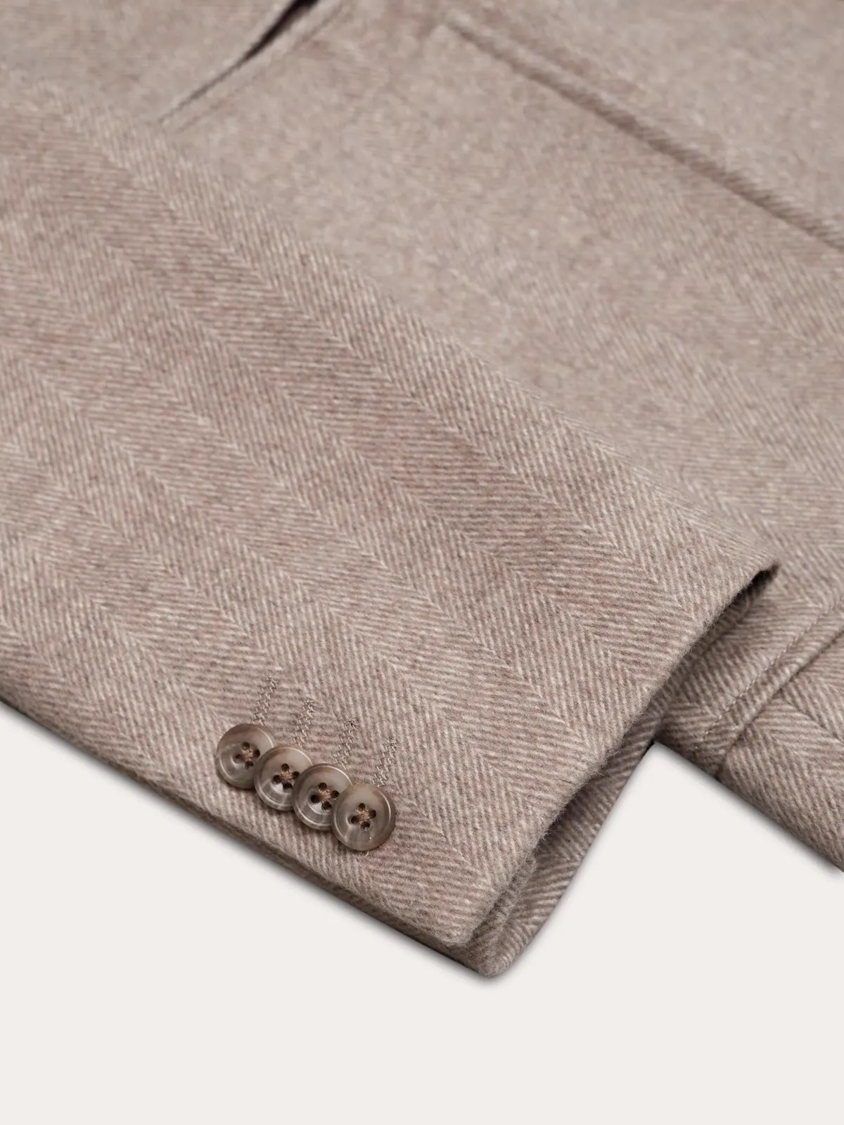 Close-up of the sleeve buttons on a light hybrid jacket