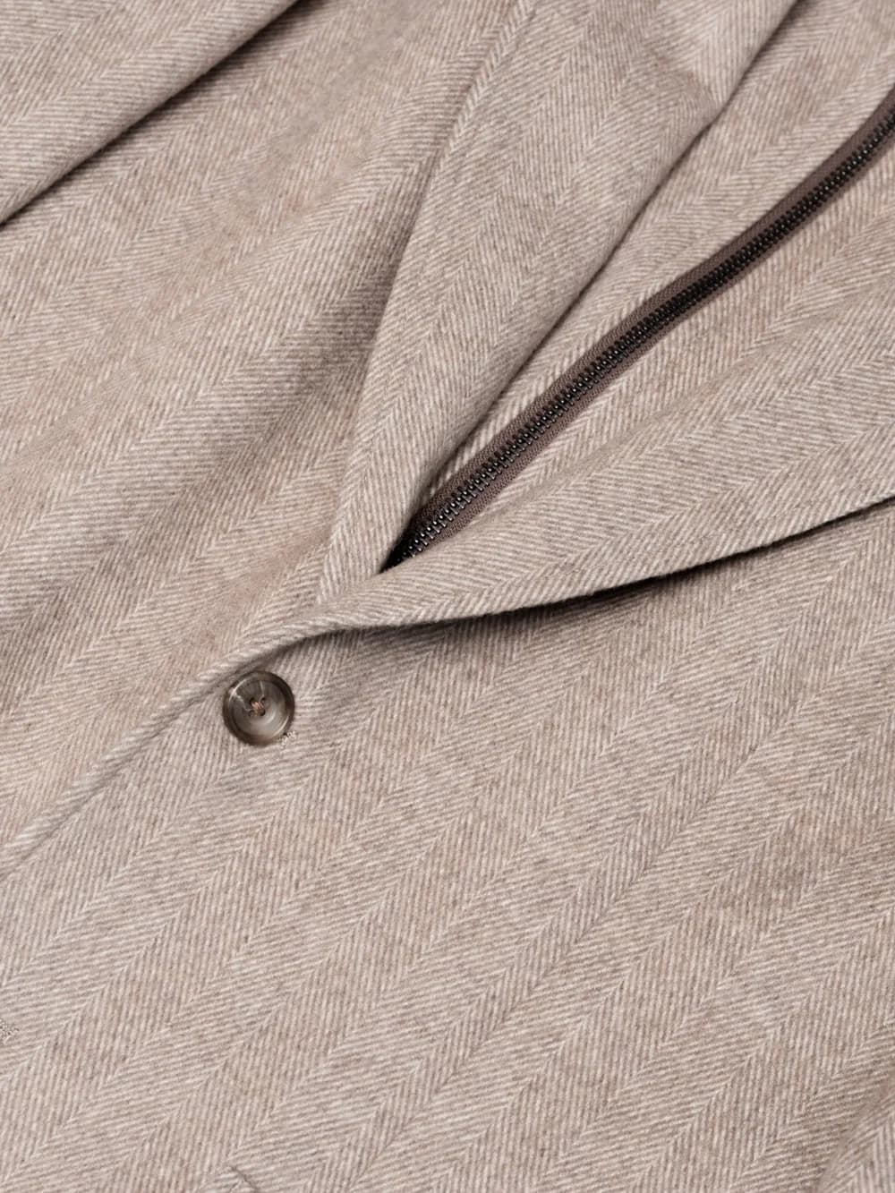 Detail of a double-breasted suit showing lapel and buttons