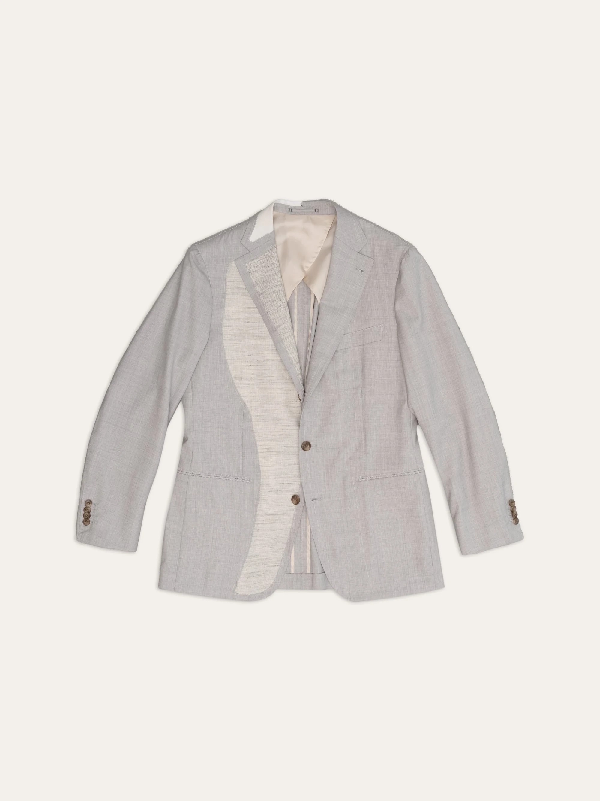 Jacket with the front folded back, showing the canvas and lining