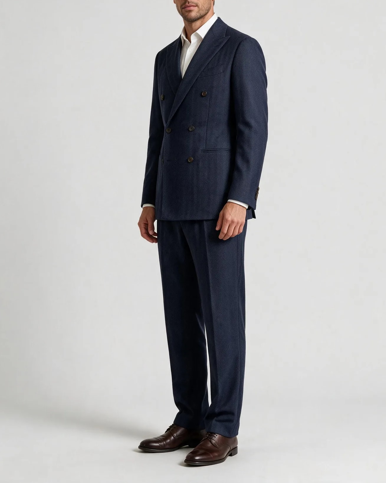 Dark Navy Herringbone Double-Breasted Suit in English Wool, on model