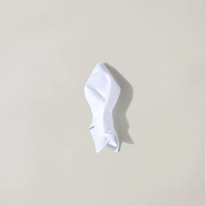 Folding a pocket square into a puff - step 3