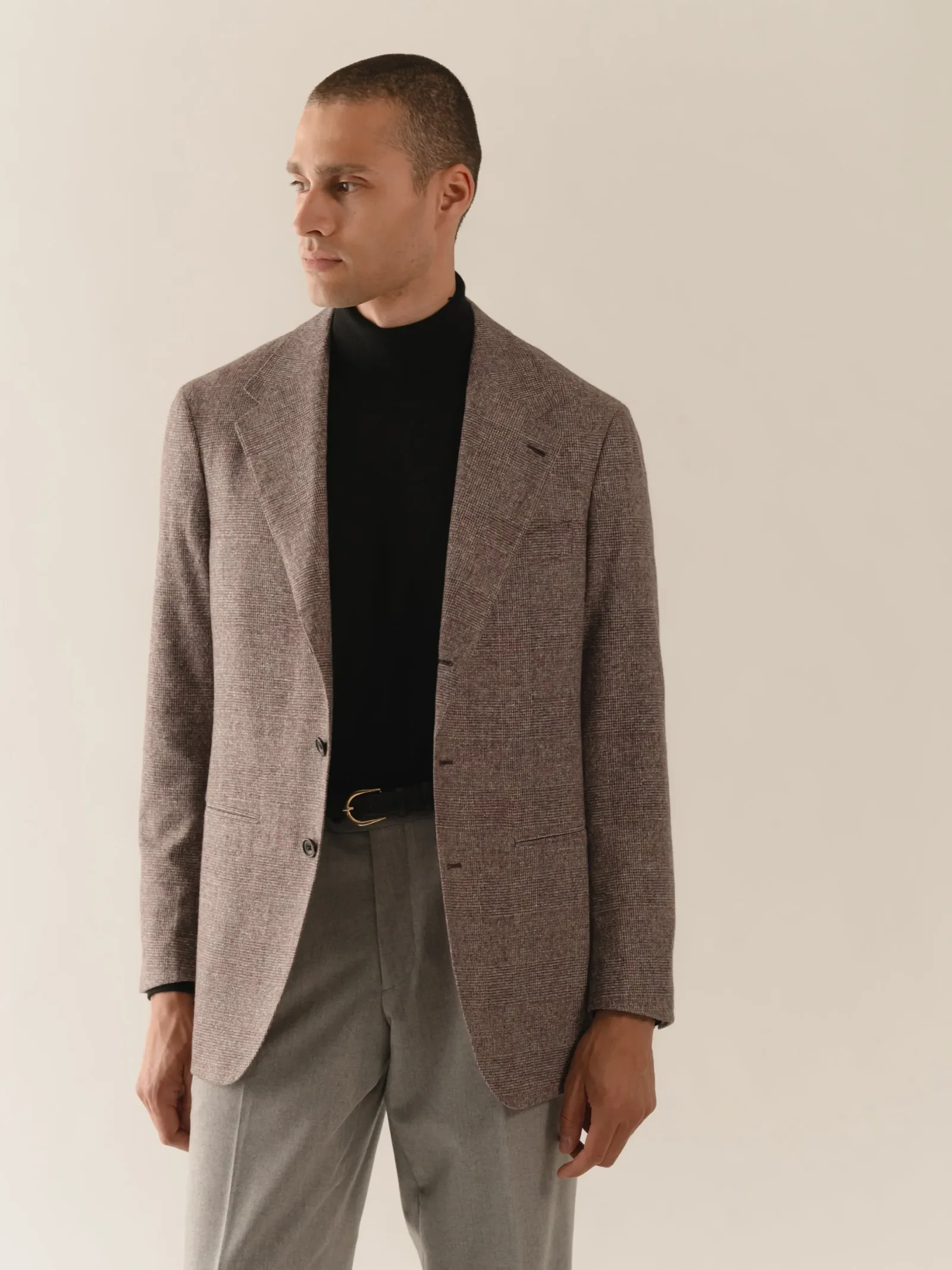 Grey blazer over a black roll neck, the second blazer in the wardrobe