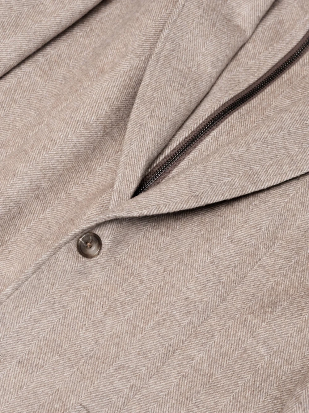 Detail of a double-breasted suit showing lapel and buttons