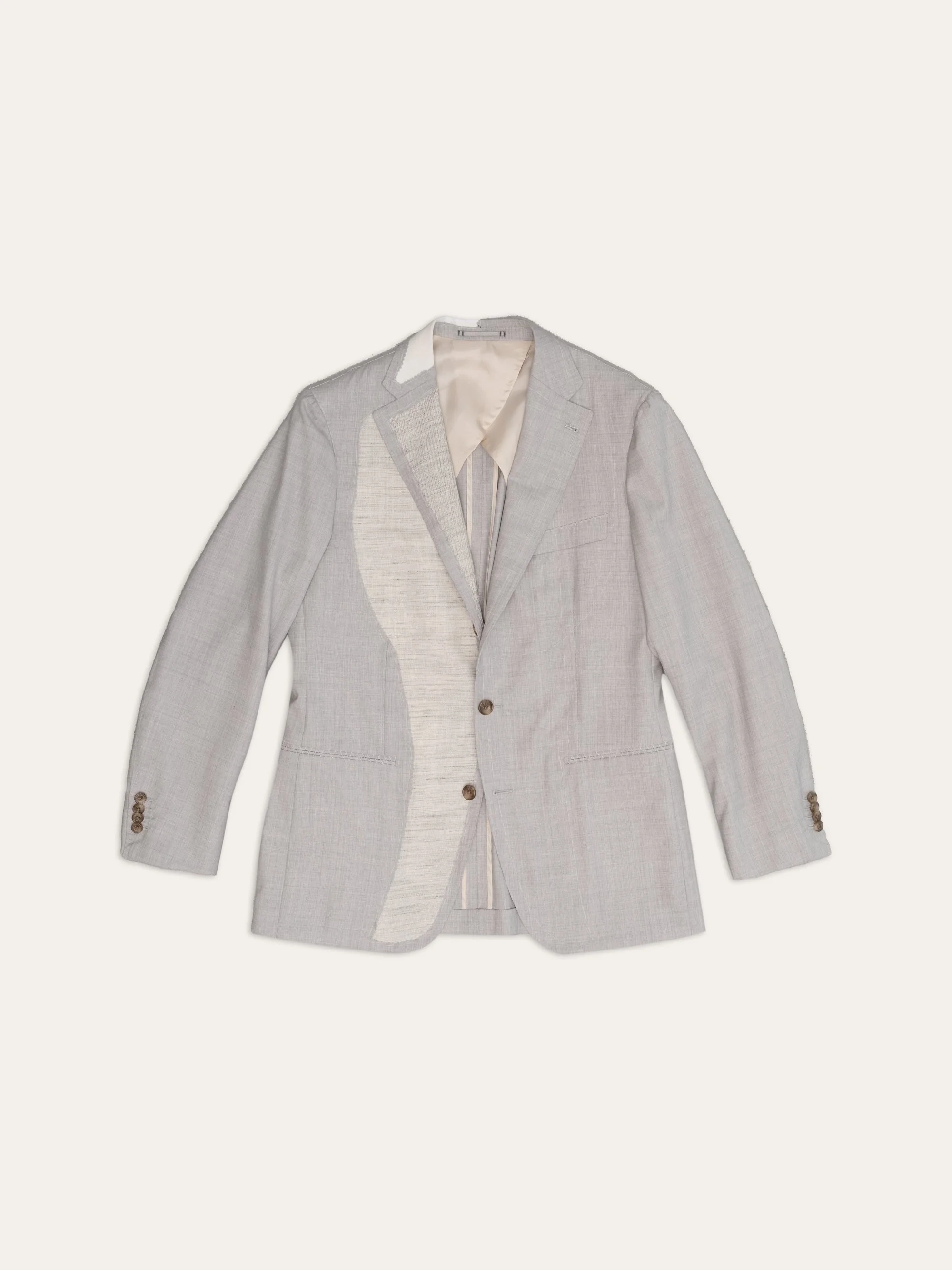 Jacket with the front folded back, showing the canvas and lining