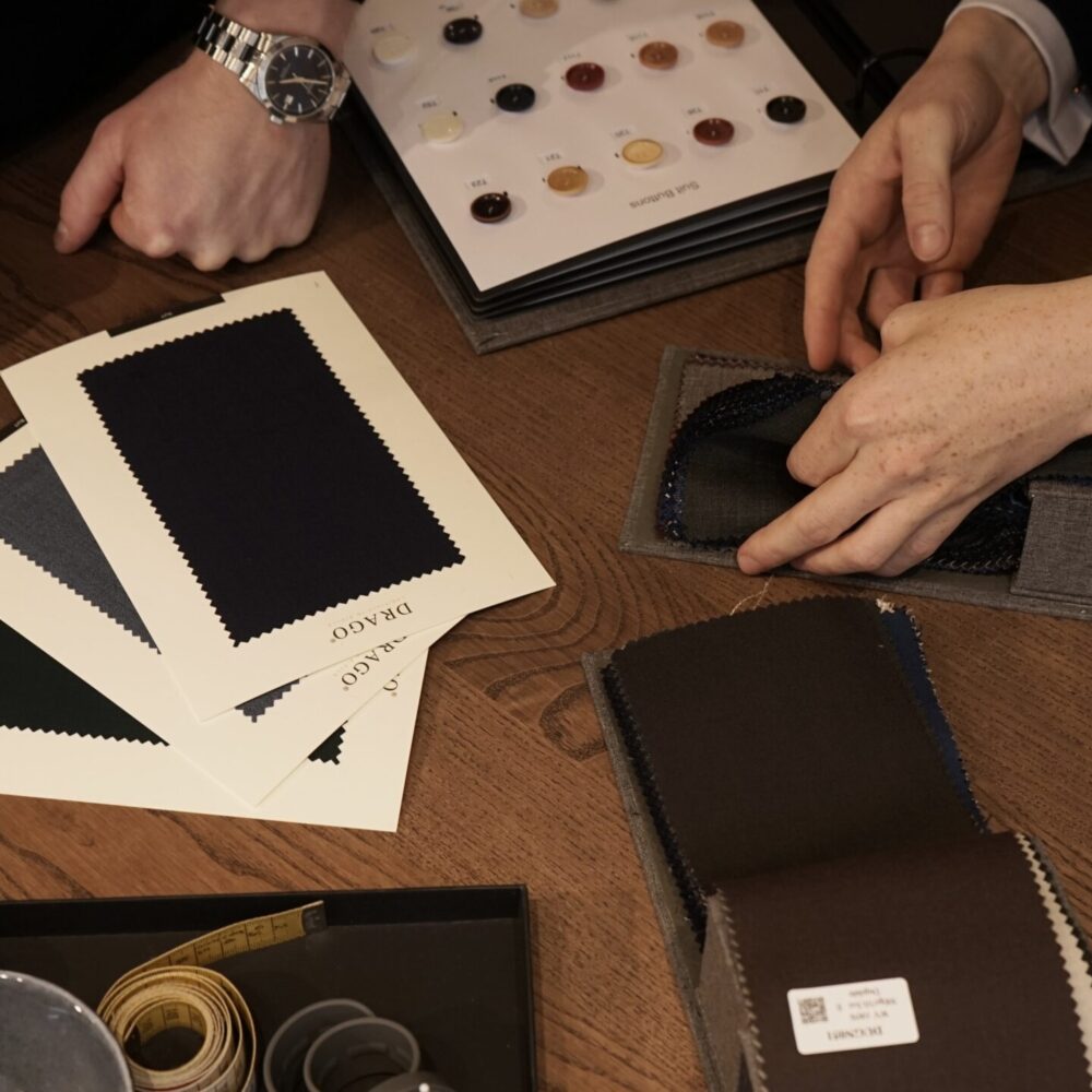 Suit garments on table for client house of vinterberg1