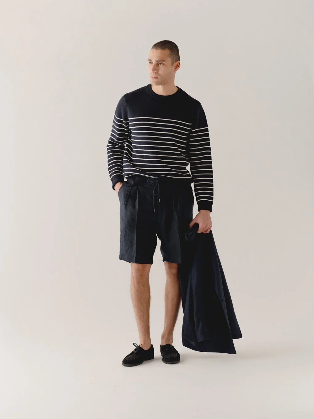 Striped jumper with shorts and jacket.